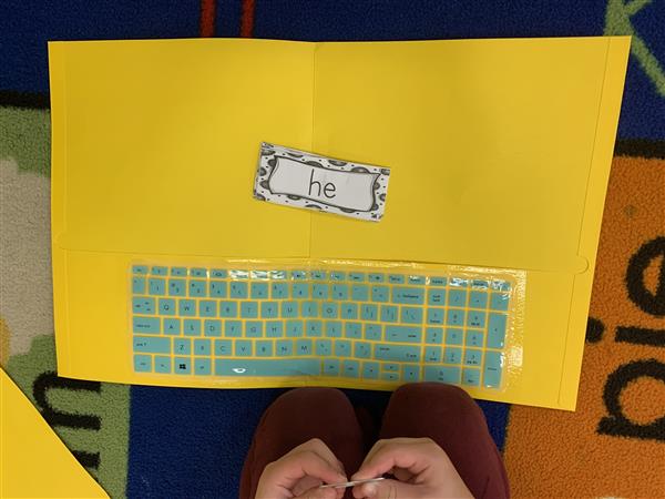 Typing in our sight words using a keyboard cover.